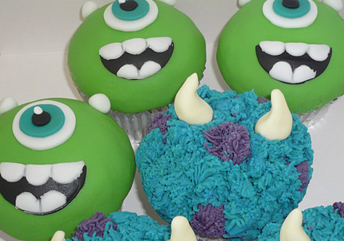 Cup cakes that look like characters from the 'Monsters Inc' film